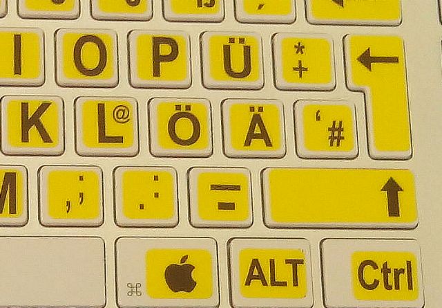 weiße USB-Tastatur für Apple Macintosh, mit gelbem Hintergrund