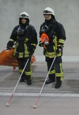 Feuerwehrmann mit Stock